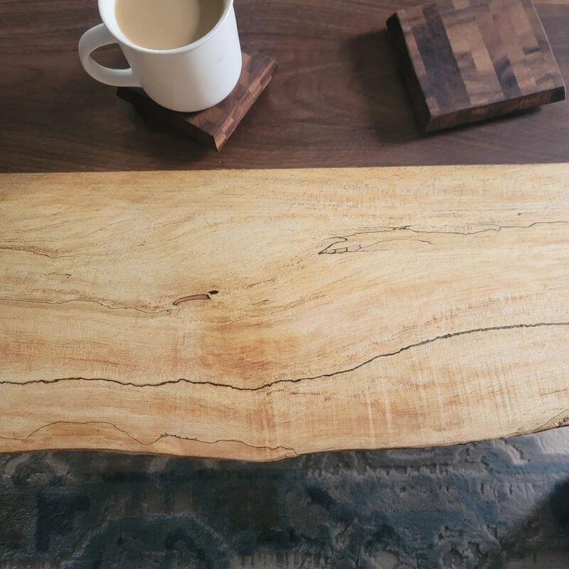Spalted maple board on walnut table